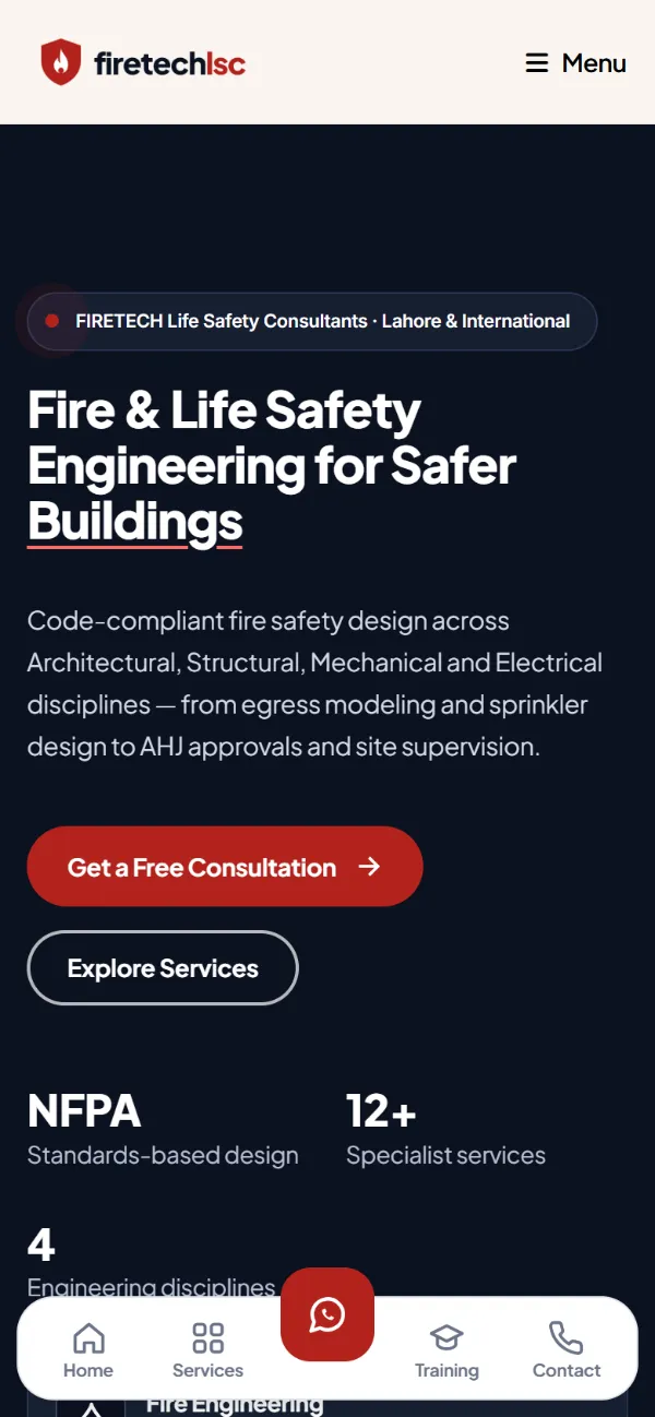 FIRETECH fire safety consultancy website on mobile with responsive hero and WhatsApp consultation button